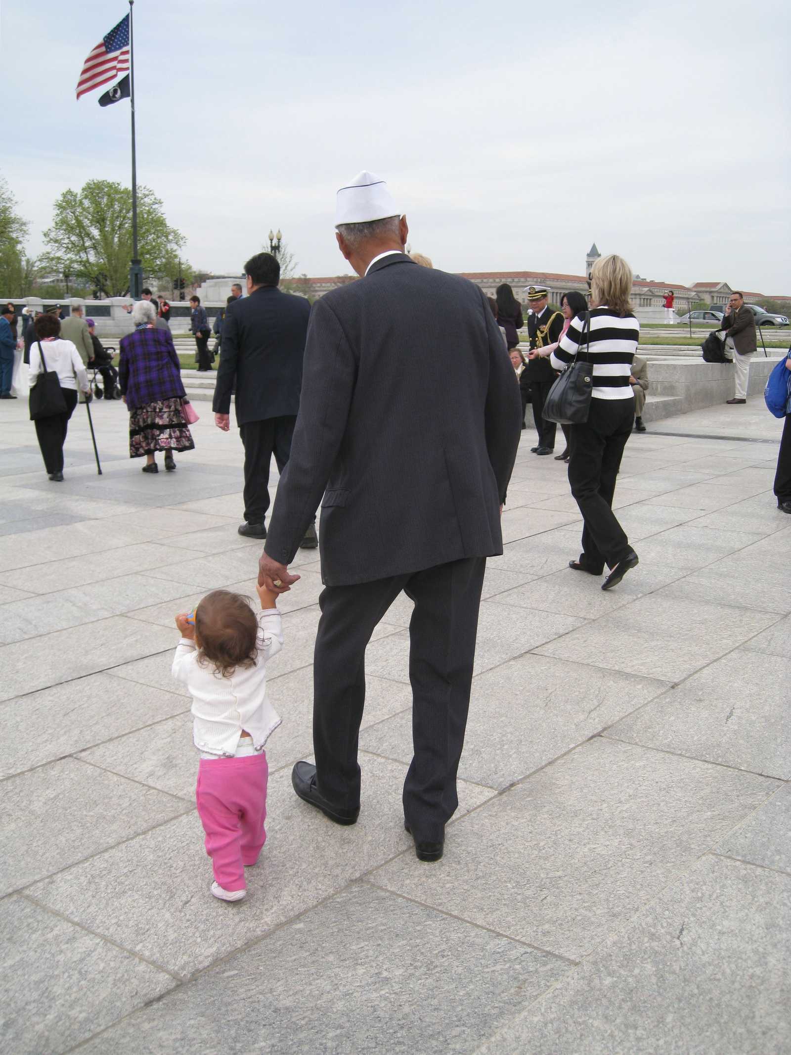 USAFFE Veteran Jesse Baltazar at the World War II Memorial with his youngest grandchild, Ciara