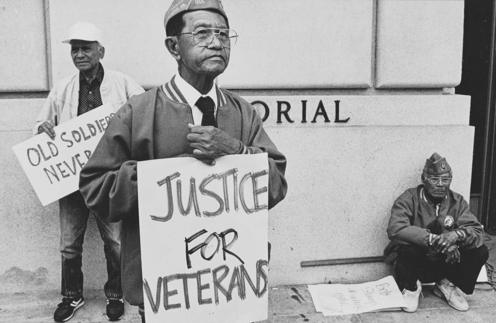Filipino veterans demonstrate in front of Veterans Memorial Building,