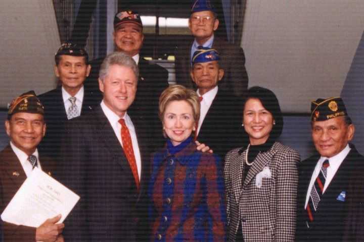 Bill and Hilary Clinton with veterans. 